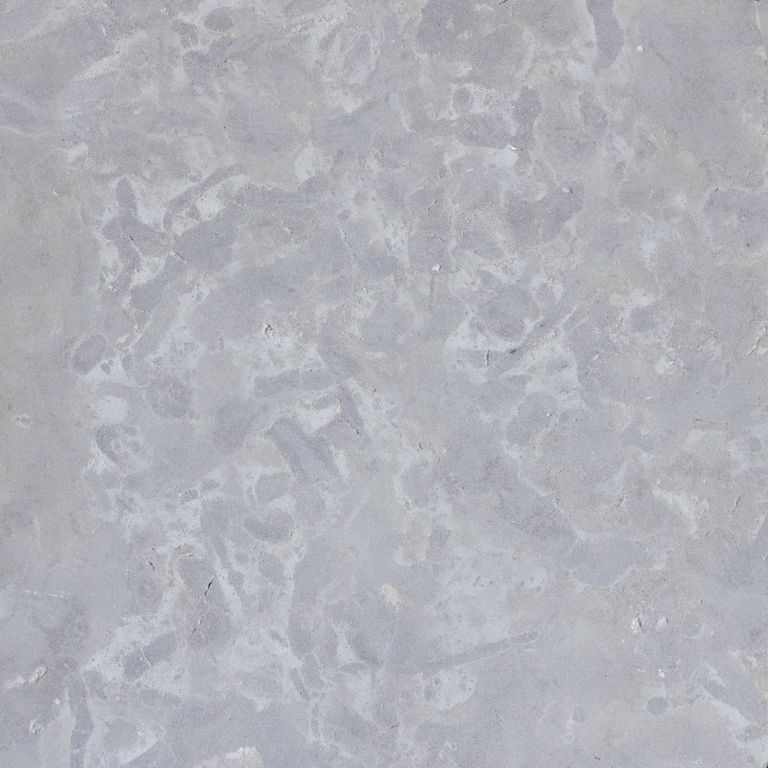 Color/Finish variation image for Limestone - Midwest Gray. The surface finish shown is honed. Dominant colors shown are blue and gray; with tan and cream secondaries. The color mix creates a warm feeling. Random color pattern.