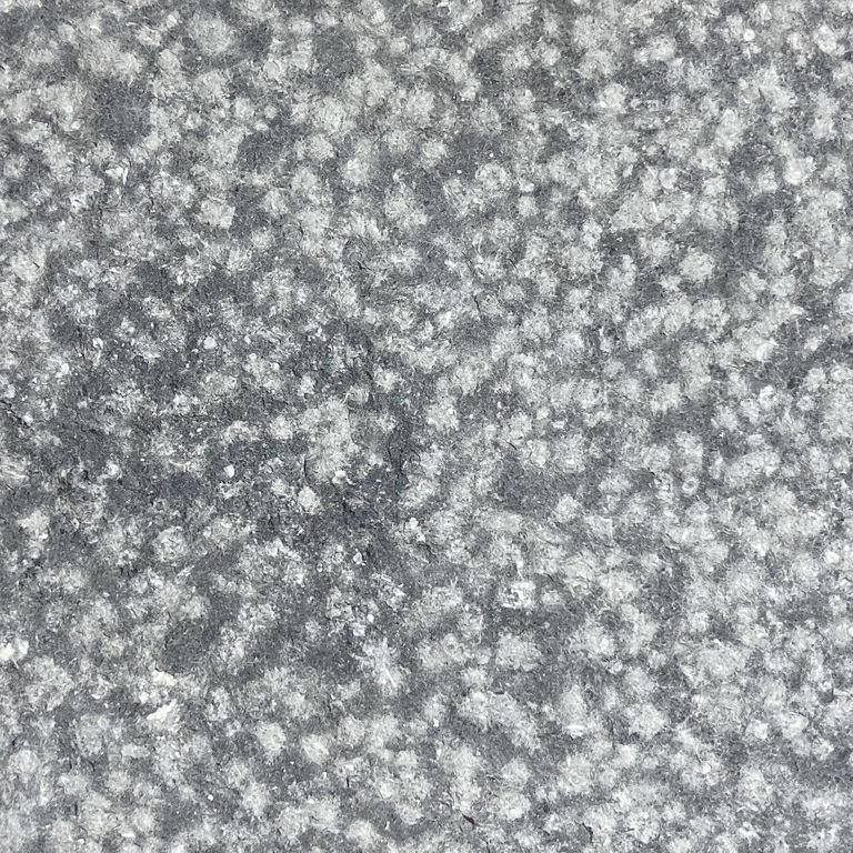 The surface finish shown is coarse bush hammered. The dominant color shown is gray. The color mix creates a cool feeling. Speckled and blotched color patterns.