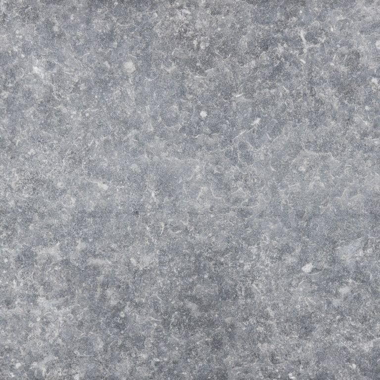 Best close-up image for Kilkenny Limestone. The surface finish shown is flamed. The dominant color shown is gray; with a white secondary. The color mix creates a cool feeling. Regular color pattern.