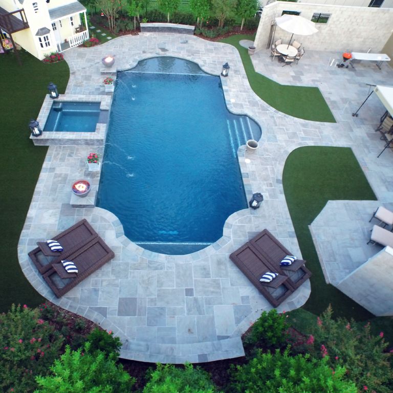 Feature image for Promenade Sandstone. The image shows this material being used for pool coping, wallstone cap, path pavers, patio pavers, full bed veneer, thin veneer and pool deck pavers. The surface finish shown is natural cleft. The dominant color shown is blue; with a gray secondary. The color mix creates a cool feeling. Regular color pattern.