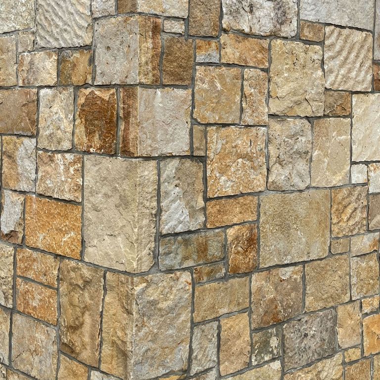 Best close-up image for South Bay Quartzite. The image shows this material being used for full bed veneer and thin veneer. The surface finish shown is split-face. Dominant colors shown are beige, brown, orange/rust and tan; with gray and cream secondaries. The color mix creates a warm feeling. Regular and blotched color patterns.