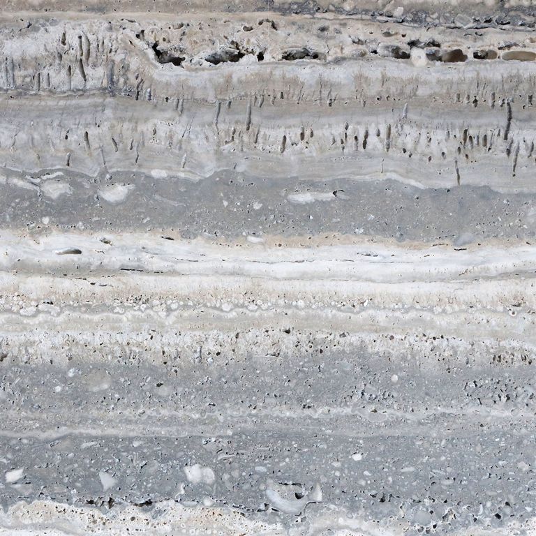 Feature image for Campione Travertine - Silver. The surface finish shown is honed. The dominant color shown is gray; with beige, blue, pink, white and tan secondaries. Exhibits 