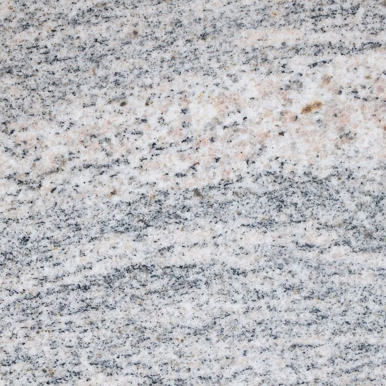 Feature image for Riverside Granite. The surface finish shown is honed. Dominant colors shown are gray and white; with beige, blue, pink and purple secondaries. Exhibits 