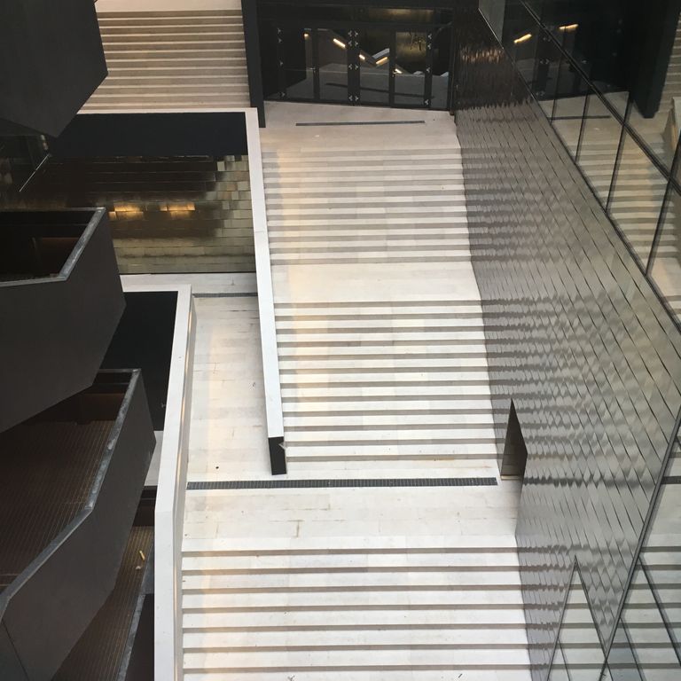 Application image for Veneto Beige Limestone - Steps & Treads. The image shows this product being used for landings, monolithic steps and treads. Dominant colors shown are beige and cream. The color mix creates a warm feeling.