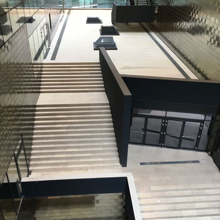 Application image for Veneto Beige Limestone - Steps & Treads. The image shows this product being used for landings and treads. Dominant colors shown are beige, tan and cream. The color mix creates a warm feeling.