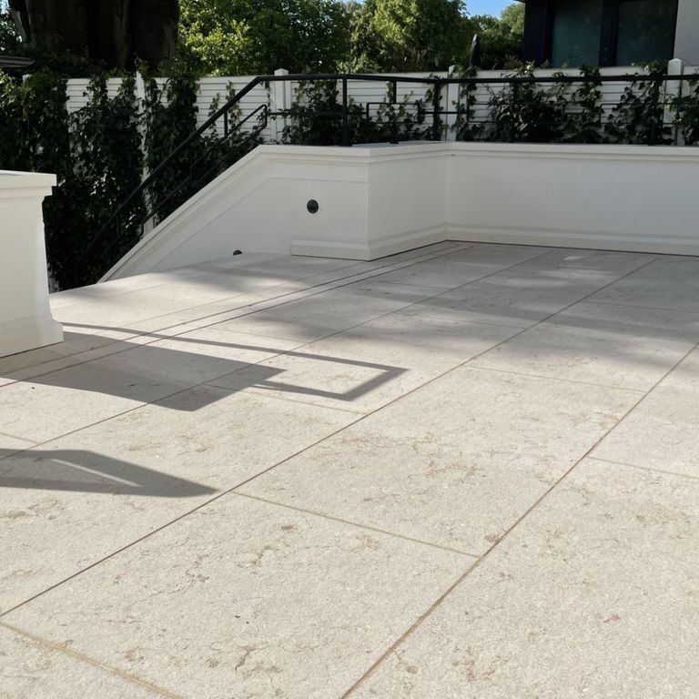 Application image for Veneto Beige Limestone - Pavers. The image shows this product being used in a patio pavers application. The surface finish shown is flamed. Dominant colors shown are beige and cream. The color mix creates a warm feeling.