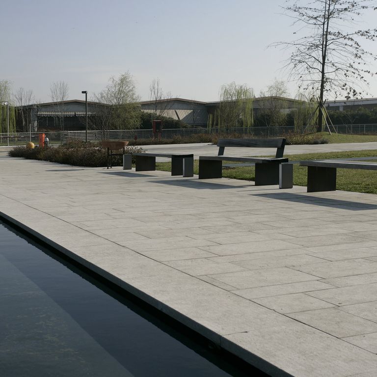 Application image for Veneto Olivo Limestone - Pavers. The image shows this product being used in a public area application. The surface finish shown is flamed. Dominant colors shown are beige and tan.