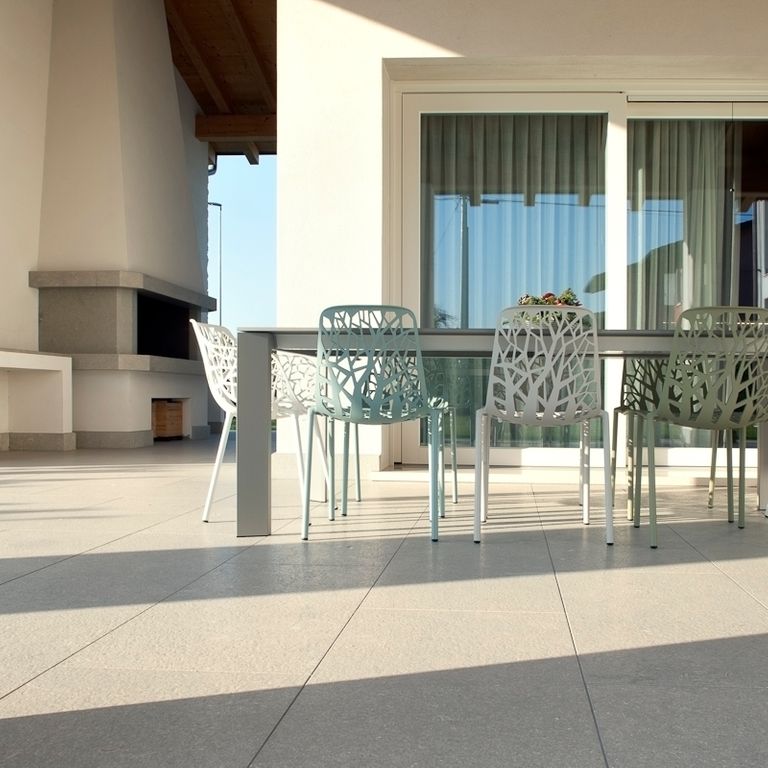 Application image for Veneto Olivo Limestone - Pavers. The image shows this product being used in a patio pavers application. The surface finish shown is honed. Dominant colors shown are beige, gray and tan. The color mix creates a cool feeling.