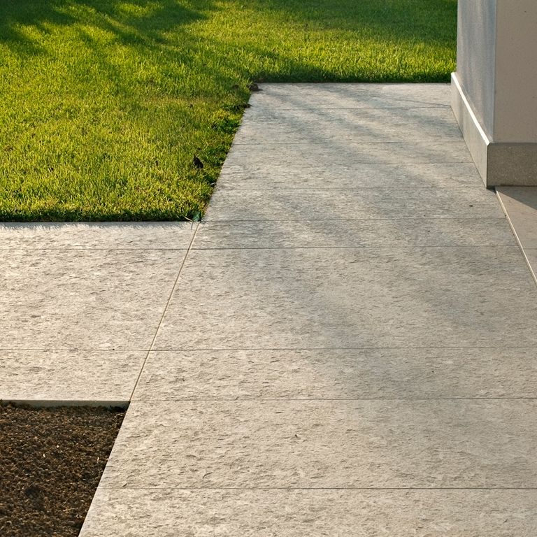 Application image for Veneto Olivo Limestone - Pavers. The image shows this product being used in a patio pavers application. Dominant colors shown are beige and tan. The color mix creates a warm feeling.
