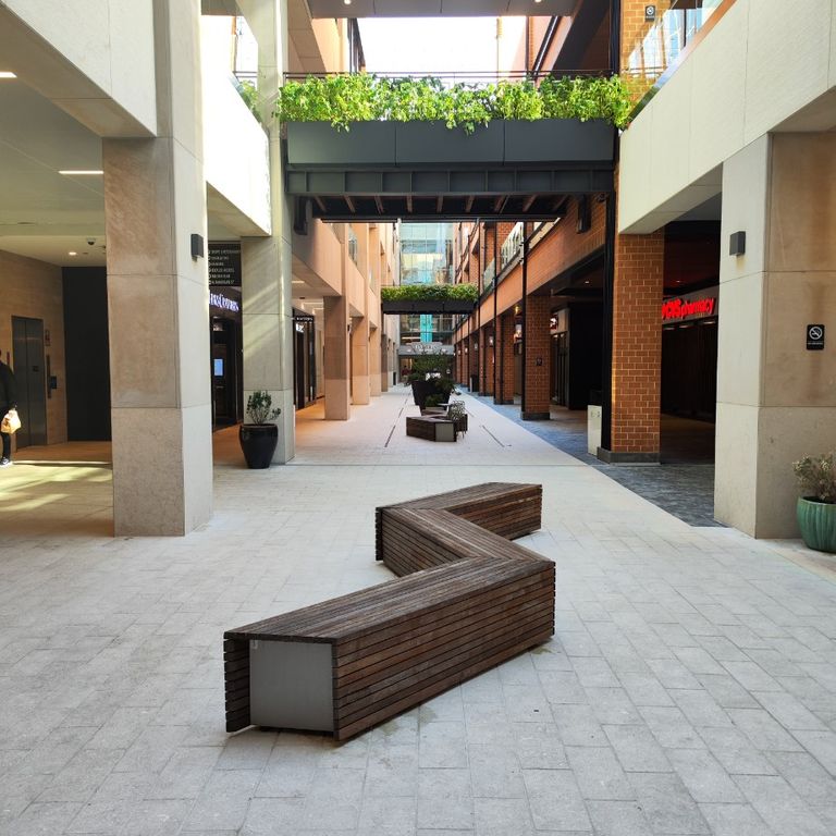 Application image for Veneto Olivo Limestone - Pavers. The image shows this product being used in a public area application. The surface finish shown is flamed. The dominant color shown is gray. The color mix creates a warm feeling.