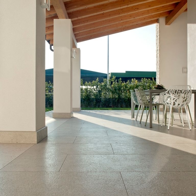 Application image for Veneto Olivo Limestone - Pavers. The image shows this product being used in a patio pavers application. The surface finish shown is honed. Dominant colors shown are gray and tan. The color mix creates a warm feeling.