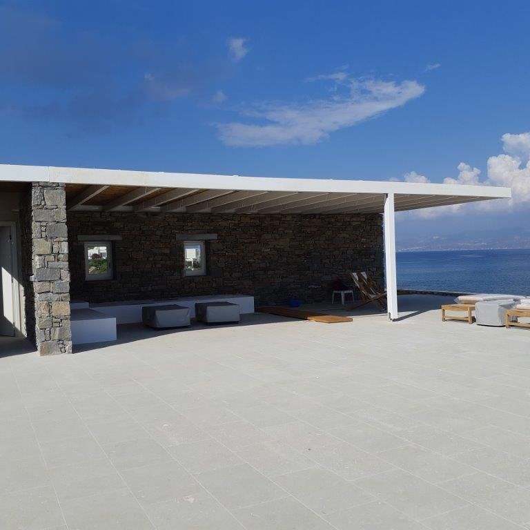 Application image for Veneto Olivo Limestone - Pavers. The image shows this product being used in a patio pavers application. The surface finish shown is flamed. The dominant color shown is gray. The color mix creates a warm feeling.
