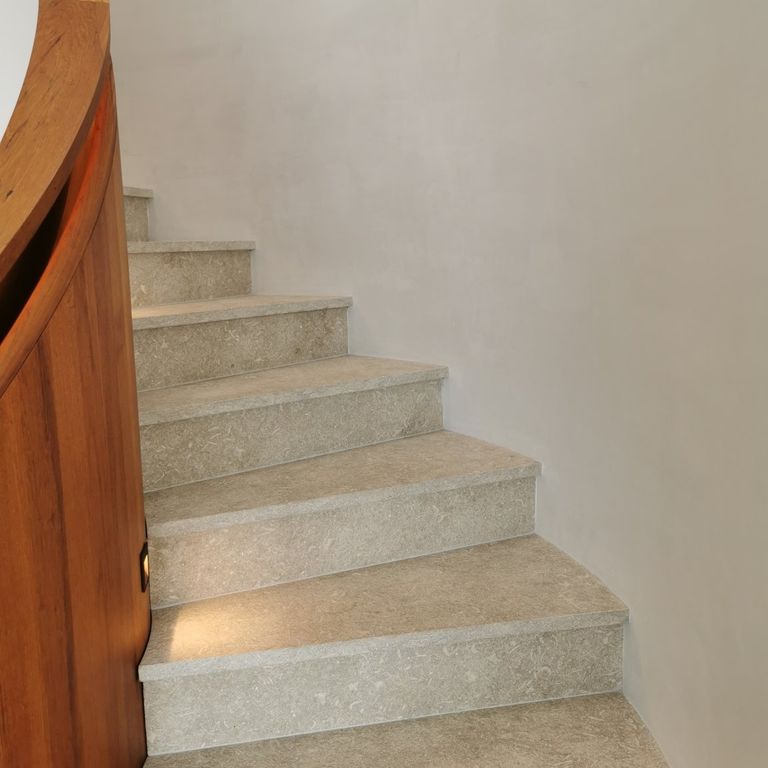 Application image for Veneto Olivo Limestone - Steps & Treads. The image shows this product being used in a treads application. The surface finish shown is . Dominant colors shown are beige and tan. The color mix creates a warm feeling.