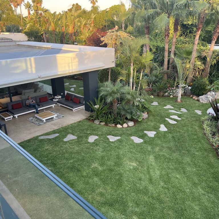 Application image for Rabat Beige Limestone - Pavers. The image shows this product being used in a patio pavers application. The surface finish shown is brushed. The dominant color shown is tan. The color mix creates a warm feeling.