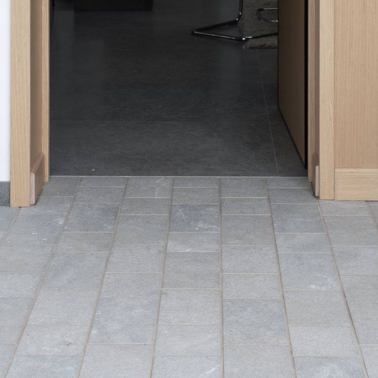 Application image for Casablanca Limestone - Pavers. The image shows this product being used in an interior floor application. The surface finish shown is . The dominant color shown is gray. The color mix creates a warm feeling.