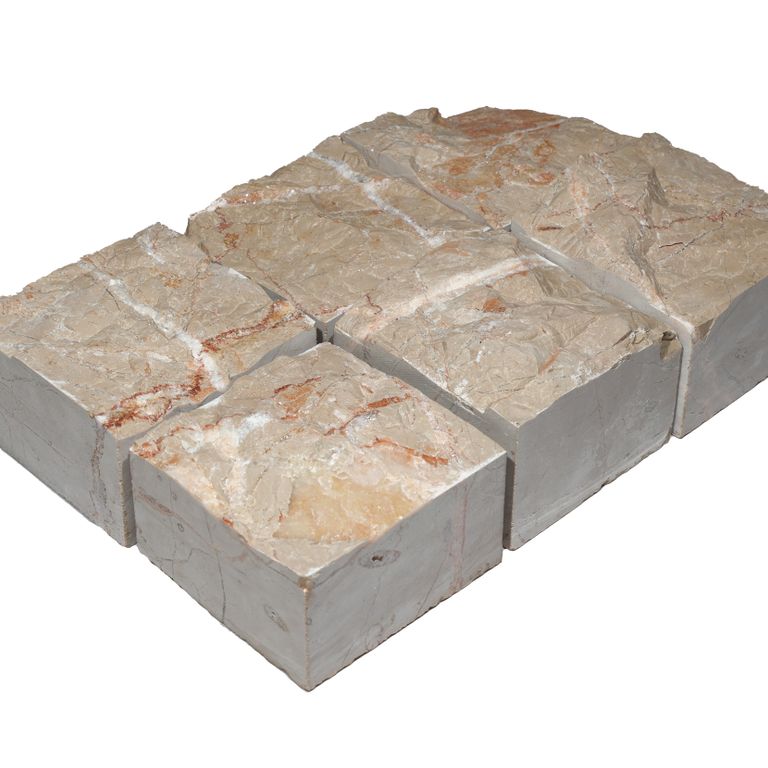 Feature image for Portugese Alpine Limestone - Cobblestone - Splitface. The surface finish shown is split-face. Dominant colors shown are beige and tan. The color mix creates a warm feeling.