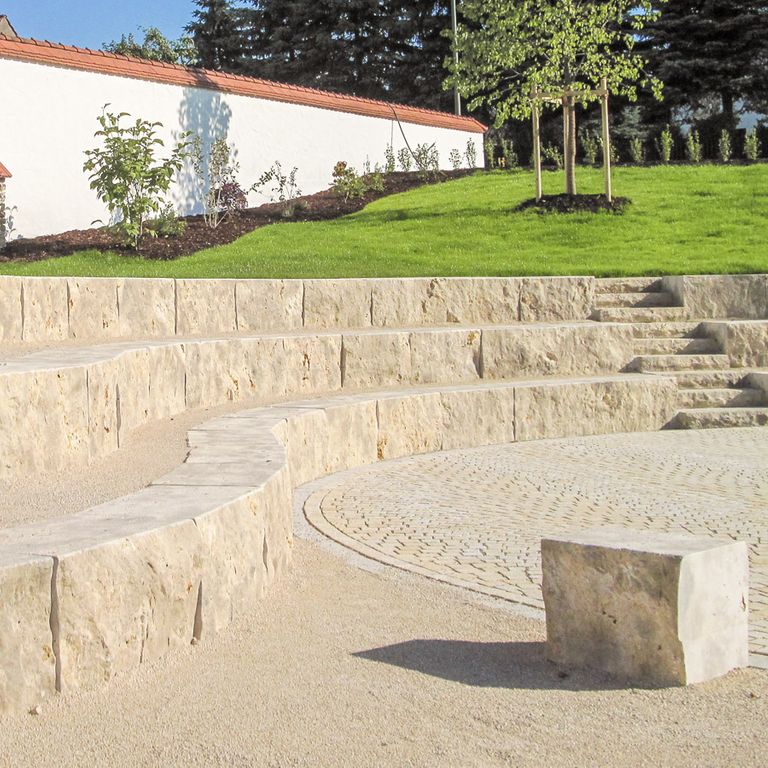 Application image for Bavarian Dolomite Gray Limestone - Steps & Treads. The image shows this product being used in a monolithic steps application. The surface finish shown is split-face. Dominant colors shown are gray and tan. The color mix creates a warm feeling.