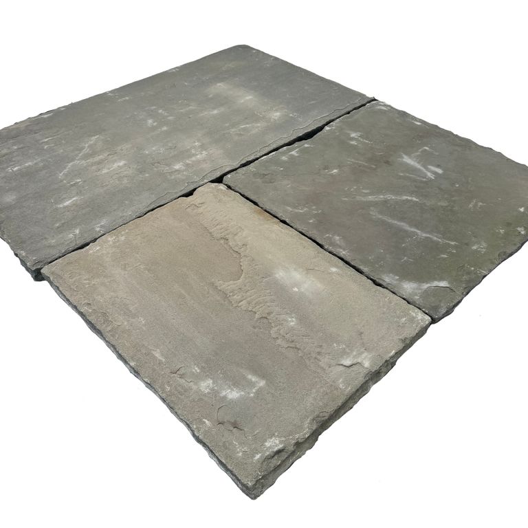Oblique image for Reclaimed Bluestone Hand Cut Pavers. The surface finish shown is natural cleft. Dominant colors shown are green and gray. The color mix creates a cool feeling.