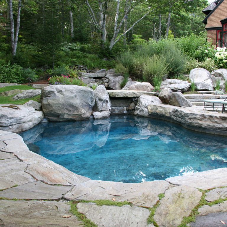 Feature image for Granite- Mystic Mountain- Natural - Oversized Pavers. The image shows this product being used for pool coping and pool deck pavers. The dominant color shown is gray; with beige, purple and white secondaries. Exhibits 
