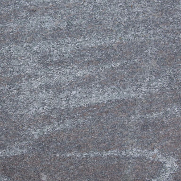 Color/Finish variation image for Granite - Mystic Mountain- Dimensional Cut Pavers. Dominant colors shown are blue and gray; with green and purple secondaries. Exhibits 