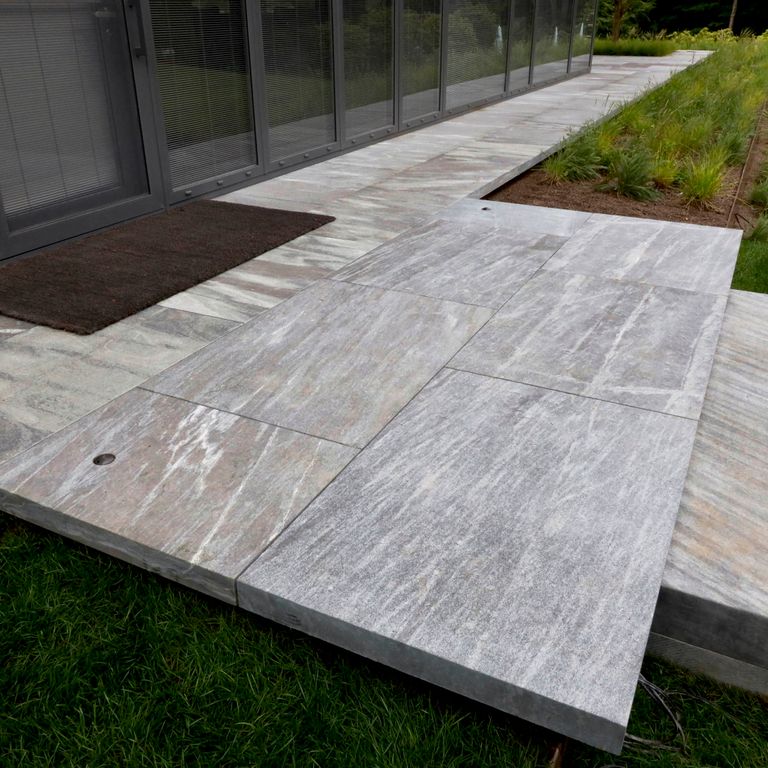 The image shows this product being used for Granite - Mystic Mountain- Dimensional Cut Pavers.