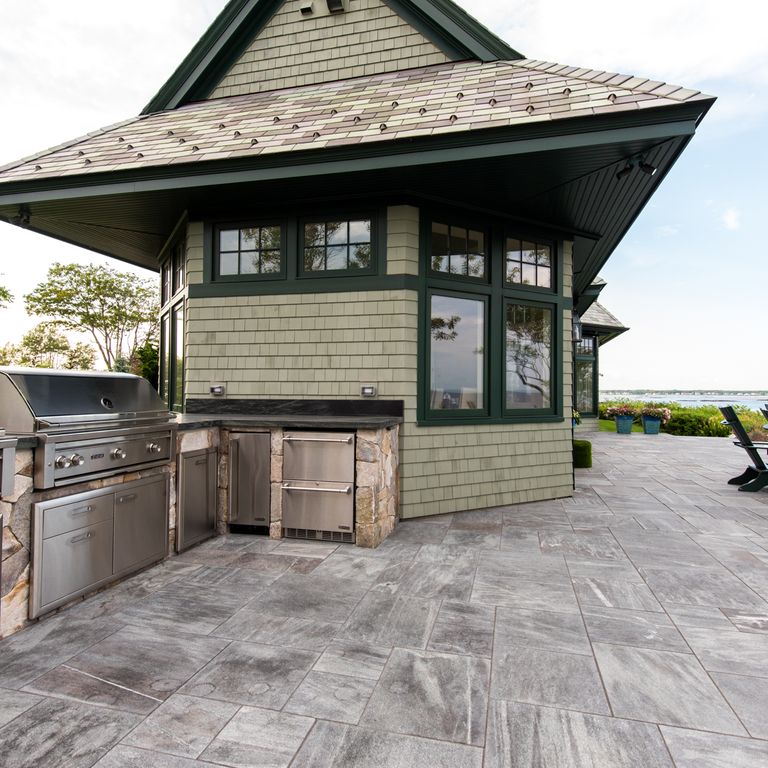 The image shows this product being used in a patio pavers application.