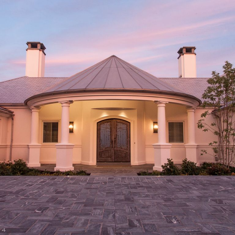 The image shows this product being used in a driveway pavers application.