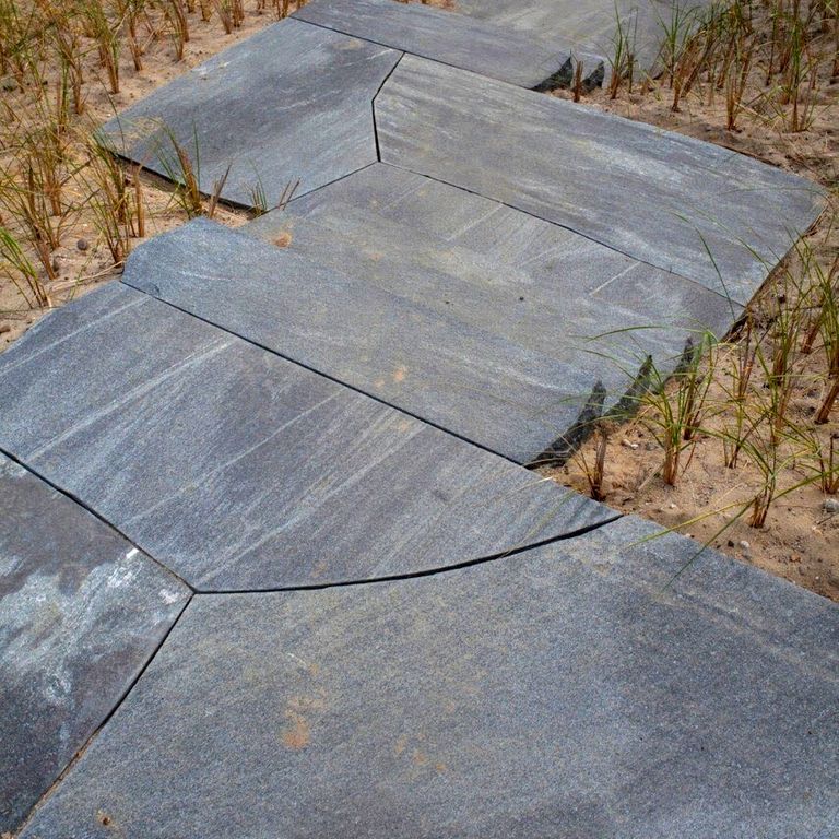 The image shows this product being used in a path pavers application.