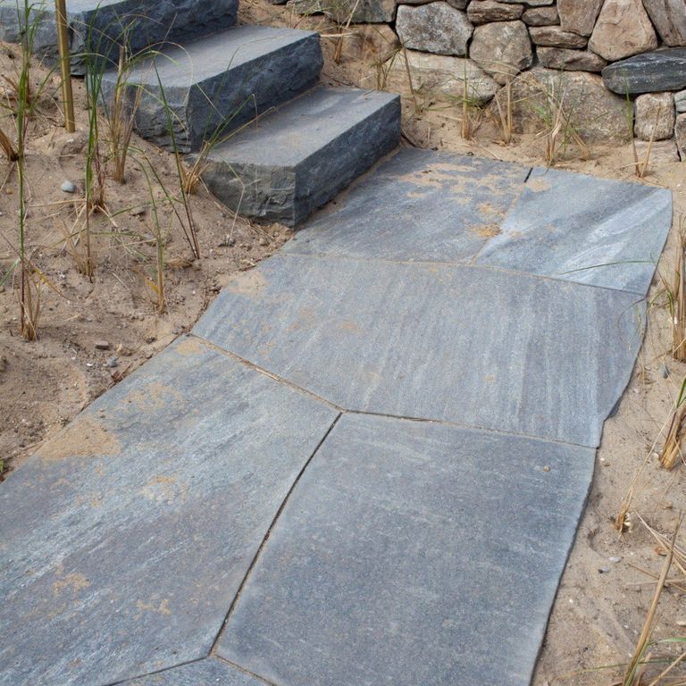 The image shows this product being used in a path pavers application.