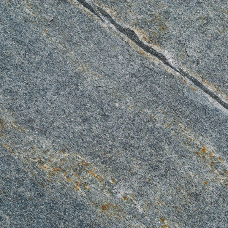 Swatch image cropped for Mystic Mountain Oversized Pavers - Live Edge. The surface finish shown is flamed. Dominant colors shown are blue, green and gray; with brown and orange/rust secondaries. Exhibits 