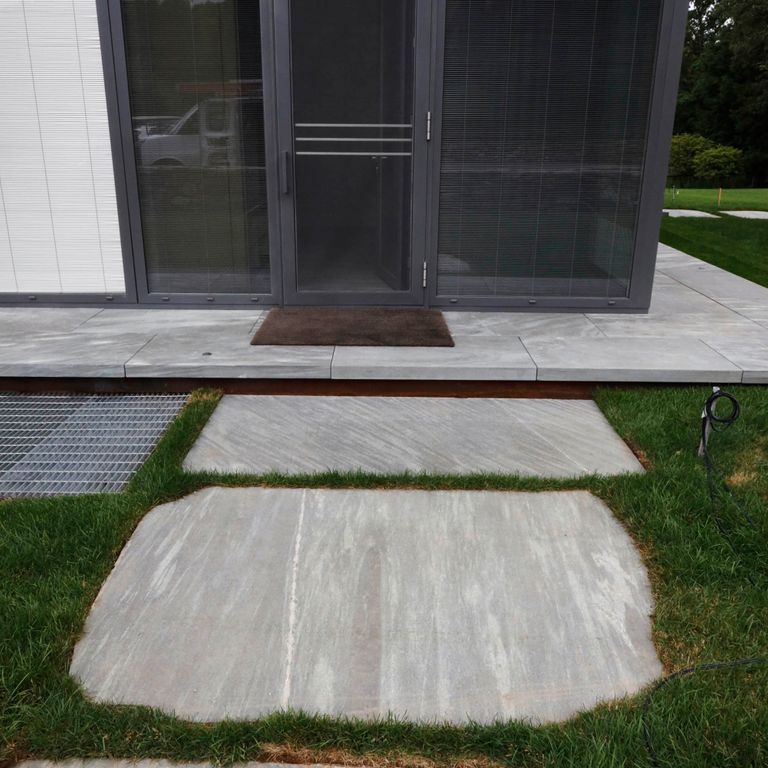 The image shows this product being used in a path pavers application.