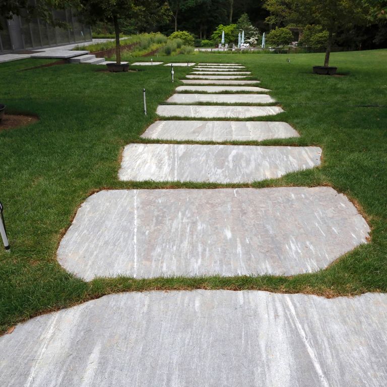 Application image for Granite - Mystic Mountain- Oversized Pavers - Live Edge. The image shows this product being used in a path pavers application. The dominant color shown is gray.