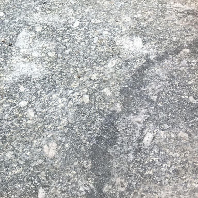 Swatch image cropped for New England Fieldstone Boulders - Sawn Landings. The surface finish shown is sawn. Dominant colors shown are gray and white; with beige, pink and cream secondaries. Exhibits 