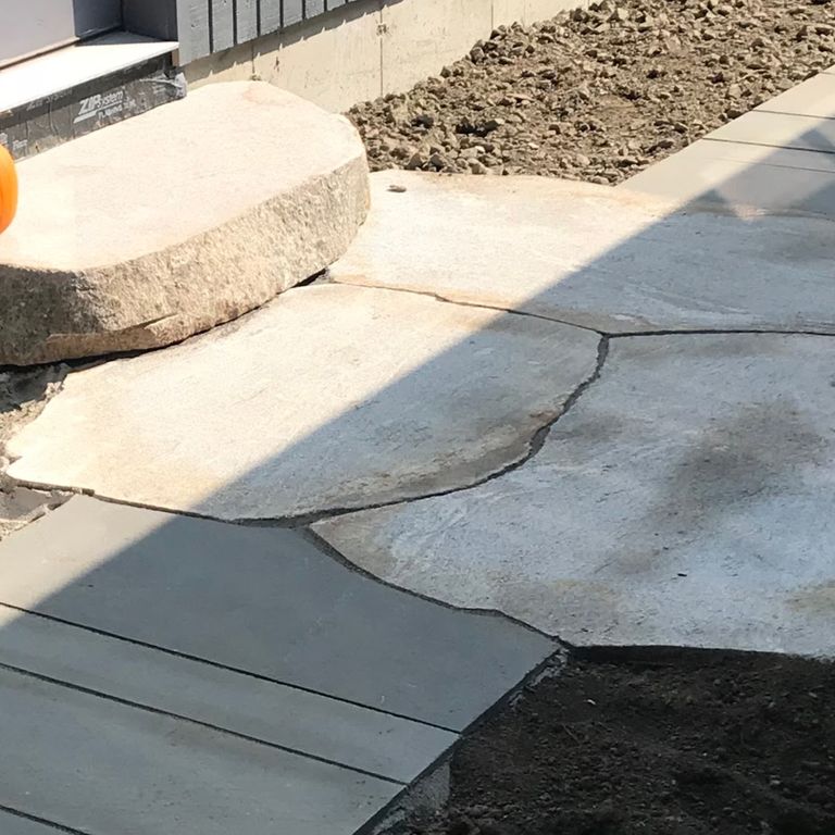 The image shows this product being used for path pavers and landings.