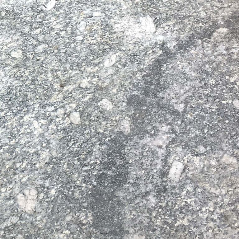 Swatch image cropped for New England Fieldstone Boulders - Sawn Pavers. The surface finish shown is sawn. Dominant colors shown are gray and white; with beige, green, pink and cream secondaries. Exhibits 