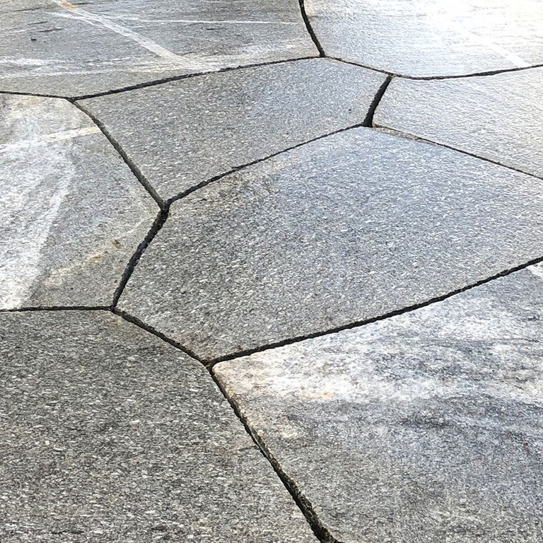 Close-up image for New England Fieldstone Boulders - Sawn Pavers. The surface finish shown is sawn. The dominant color shown is gray; with beige, pink, white and cream secondaries. Exhibits 