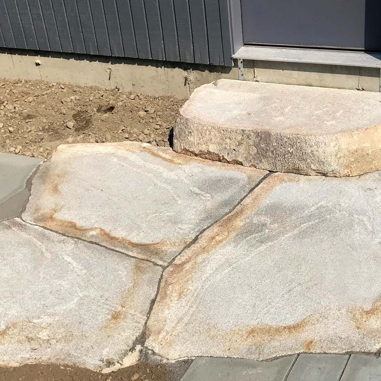 The image shows this product being used for path pavers and landings.