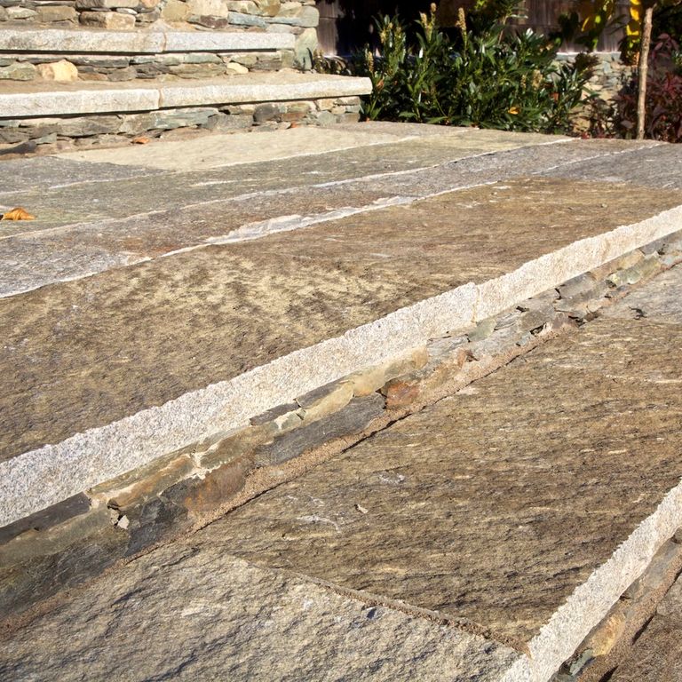 Best close-up image for Reclaimed Granite Plank Pavers - Sawn Edge. The image shows this product being used for landings and treads. The surface finish shown is . Dominant colors shown are beige, brown and tan; with gray, orange/rust and cream secondaries. Exhibits 