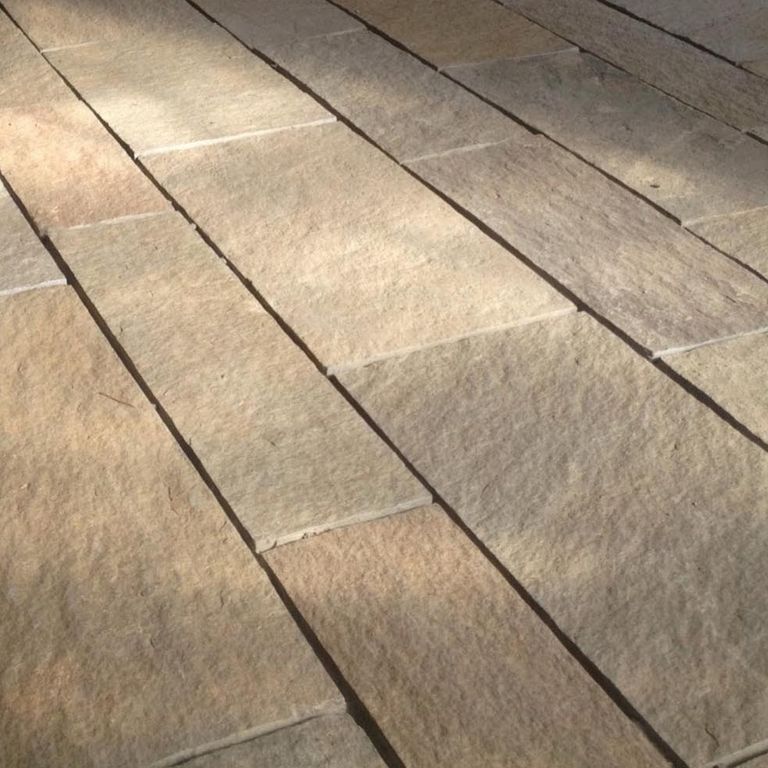 Application image for Granite - Reclaimed Plank Pavers - Sawn Edge. The image shows this product being used for path pavers and patio pavers. Dominant colors shown are brown and tan. The color mix creates a warm feeling.