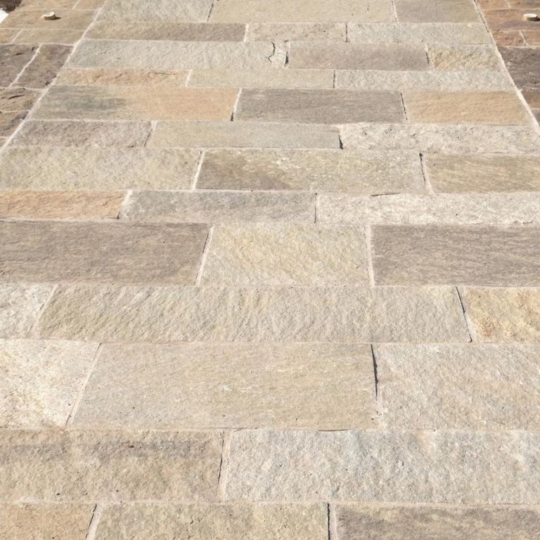 The image shows this product being used in a path pavers application.