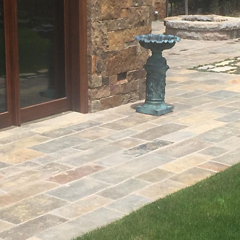 The image shows this product being used in a patio pavers application.