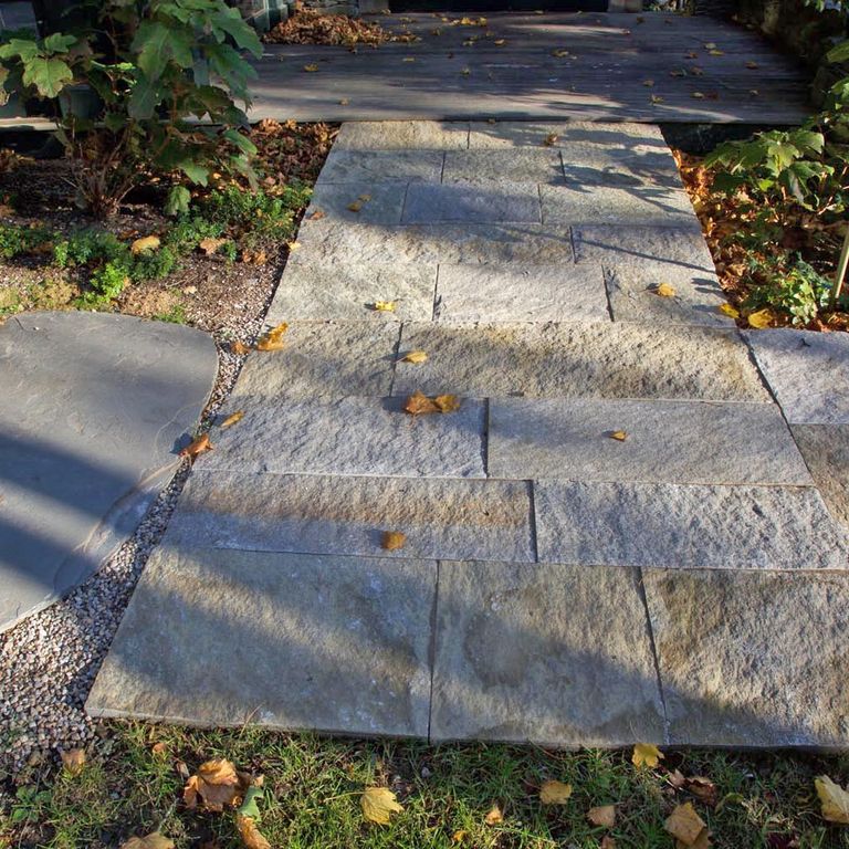 The image shows this product being used in a path pavers application.