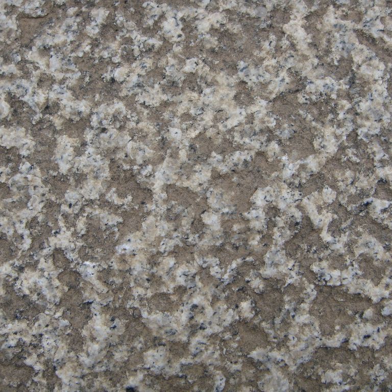 Color/Finish variation image for Reclaimed Footworn Granite - Plank Pavers. The surface finish shown is . The dominant color shown is gray; with purple and tan secondaries. Coarse speckled color pattern.
