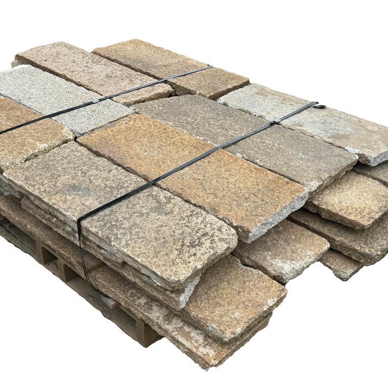 Oblique image for Reclaimed Footworn Granite - Plank Pavers. The surface finish shown is . Dominant colors shown are beige and tan. The color mix creates a warm feeling.