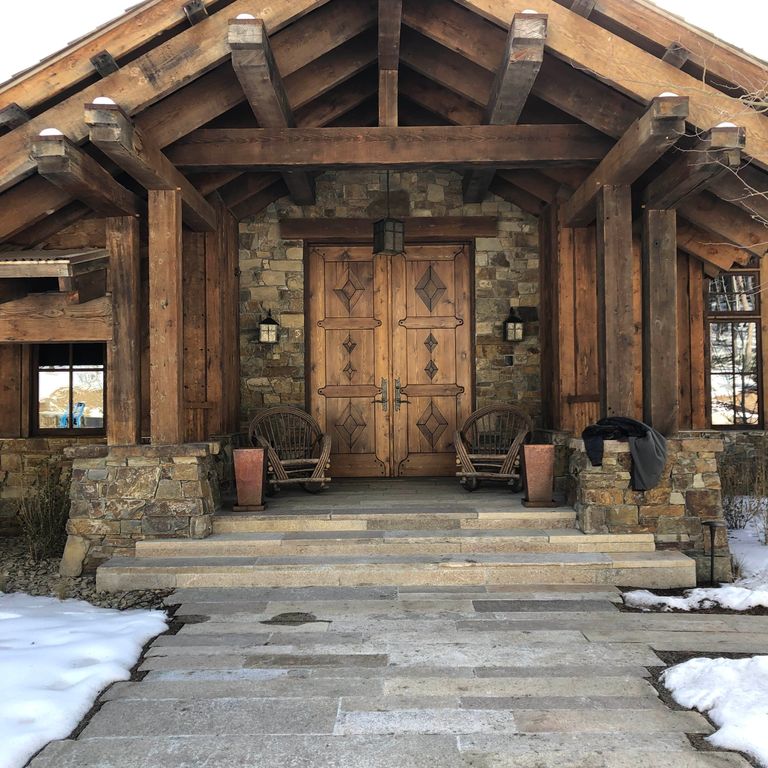 Application image for Reclaimed Footworn Granite Plank Pavers. The image shows this product being used for path pavers, landings and treads. The surface finish shown is . Dominant colors shown are brown, gray and tan. The color mix creates a warm feeling. Speckled and blotched color patterns.