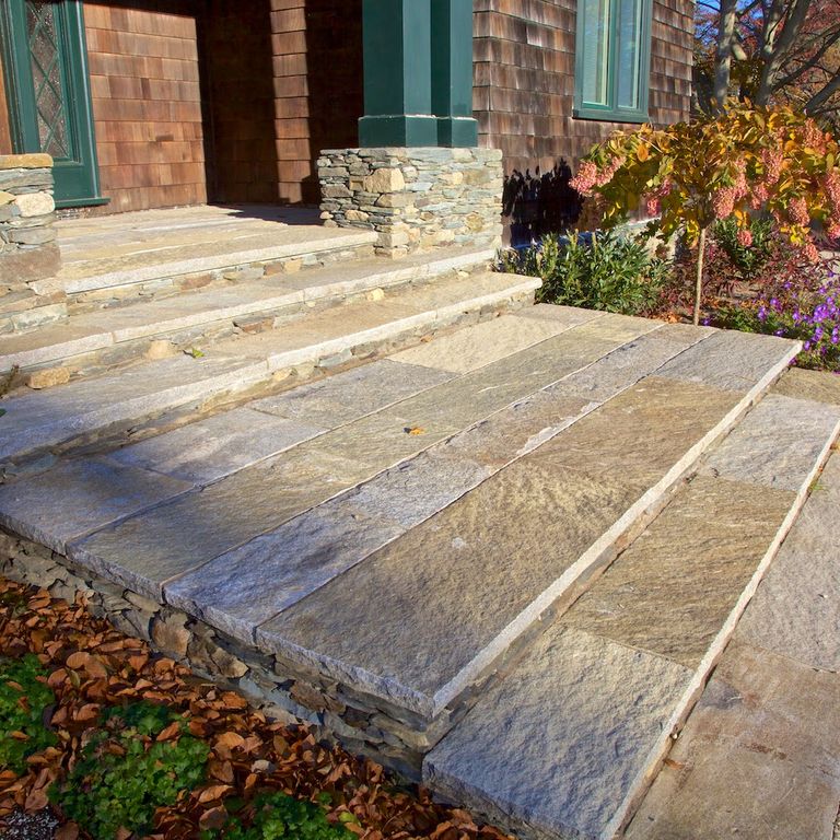 Application image for Reclaimed Granite Treads - Weathered Riser and Tread. The image shows this product being used in a treads application. This is a landscape stone for indoor and outdoor commercial and residential applications. Suitable for general use, freeze-thaw conditions, low heat absorption surfaces, high traffic areas, low slipperiness surfaces and high heel compatibilty situations. Higher to high on the price spectrum.