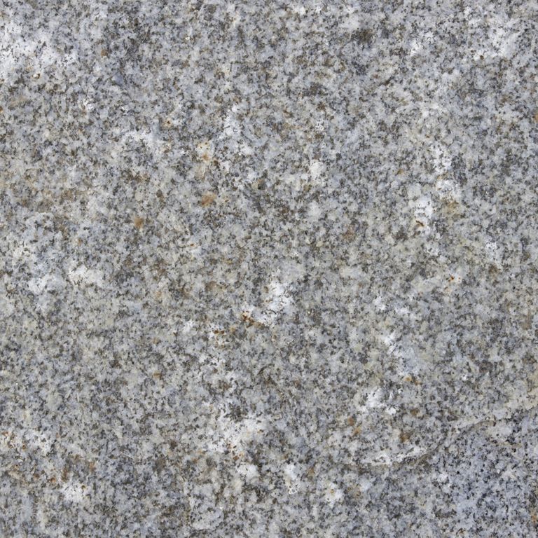 Color/Finish variation image for Reclaimed Granite Curbstone - Pool Coping. The dominant color shown is gray; with blue, green, white and tan secondaries. The color mix creates a cool feeling. Speckled, blotched and cloudy color patterns. Contains some mica and mineral inclusions.