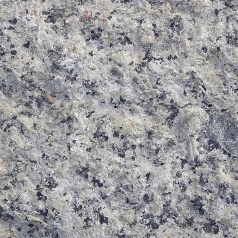 Color/Finish variation image for Reclaimed Granite Curbstone - Pool Coping. The dominant color shown is gray; with beige, blue, green and white secondaries. The color mix creates a cool feeling. Coarse speckled color pattern. Contains some mica and mineral inclusions.