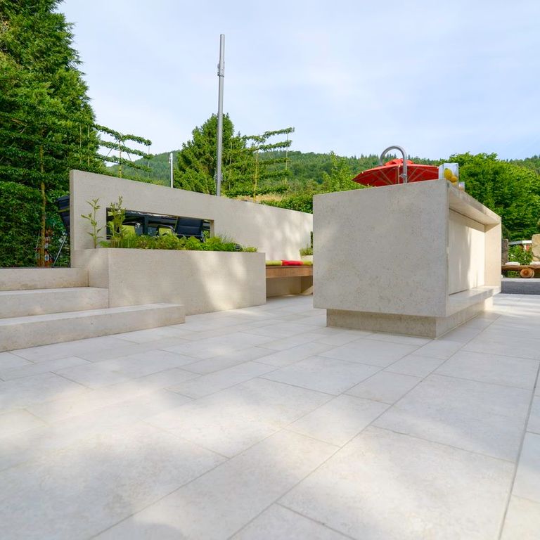 The image shows this product being used in a patio pavers application.