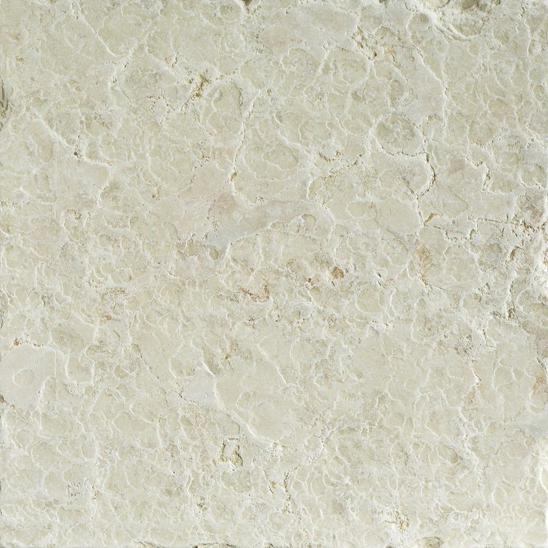 Swatch image cropped for Mountain Hard Limestone Beige - Cobblestone Pavers. The surface finish shown is flamed. Dominant colors shown are beige and cream; with gray, white and tan secondaries. Exhibits 